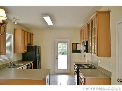 Kitchen - Kitchen has access to yard & parking are