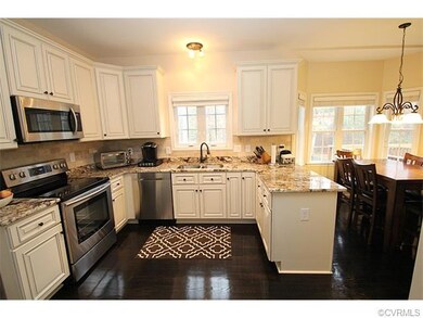 Modern Eat-in Kitchen w/ custom built-ins, wine ra