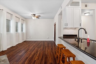 Kitchen featuring a sink, a ceiling fan, a kitche