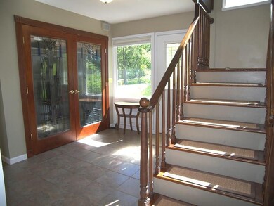 Spacious foyer with beautiful guest closet featuri