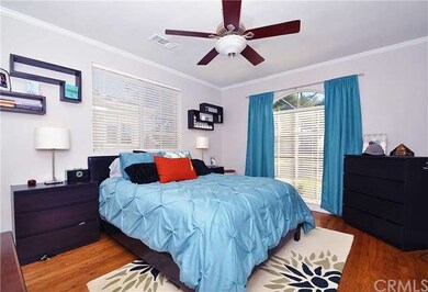 Master bedroom - hardwood floors...ceiling fan