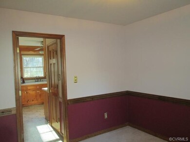 Looking from the dining room to the kitchen