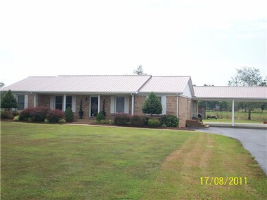 FRONT AREA OF LANDSCAPING & 2 CAR CARPORT