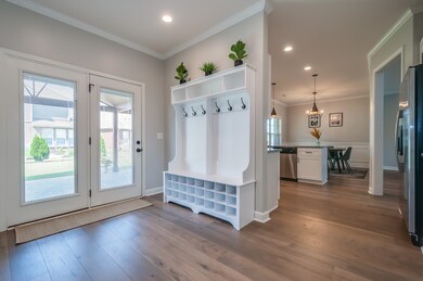 Mudroom Area With Cubbies & Rear Entry To Back Patio.
