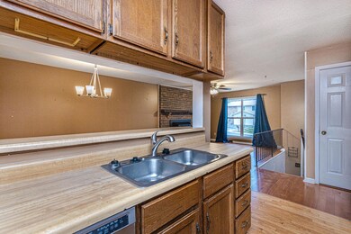 Opens to living & dining areas