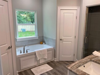 Bathroom with wood-type flooring, independent show