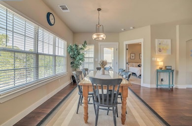 Dining space with light wood-style flooring, base