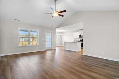 Unfurnished living room with dark wood finished fl