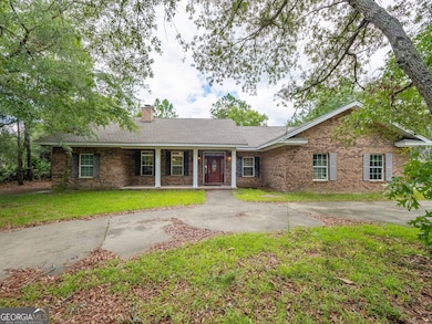 Welcome home to this charming brick-front ranch nestled under mature oaks.