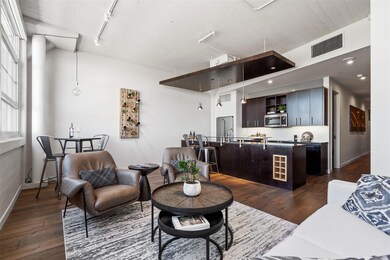 Living room with dark wood-type flooring