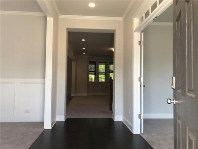 Hallway featuring ornamental molding, recessed lighting, and carpet flooring