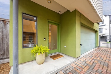 Gated entrance with a spacious two-car garage.