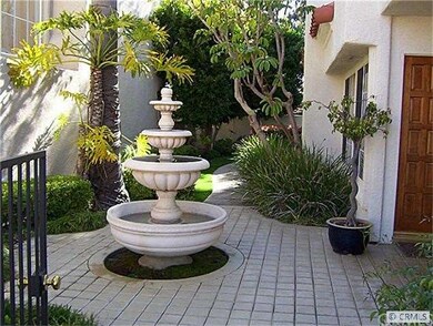 ENTRY COURTYARD W/ FOUNTAIN