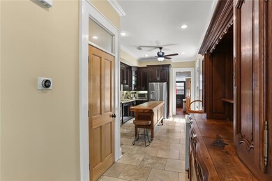 Hallway leads to kitchen.  Full bath on left.