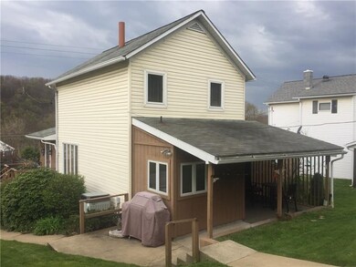 Rear View- covered walkway & patio