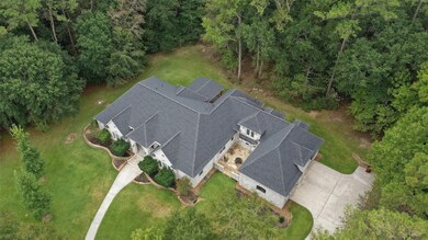 Another view of this beautiful house. Property goes way beyond the woods. Great privacy!