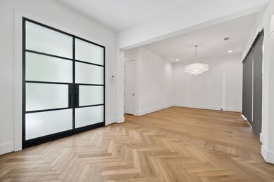 Elegant entryway features stunning herringbone-pat
