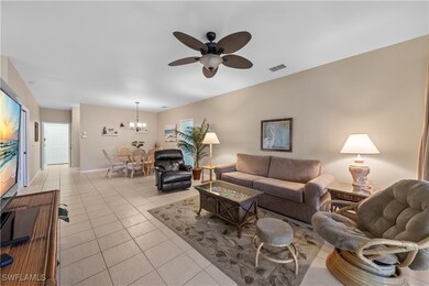 Living area featuring light tile patterned floors,