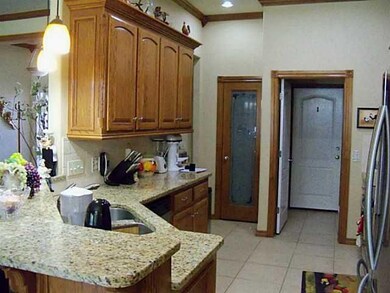 Kitchen. Crown molding throughout, custom cabinets,  granite counter tops, and New appliances.