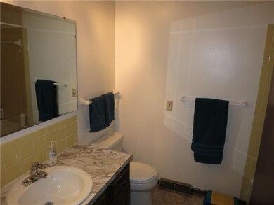 Hall bath with shower over tub