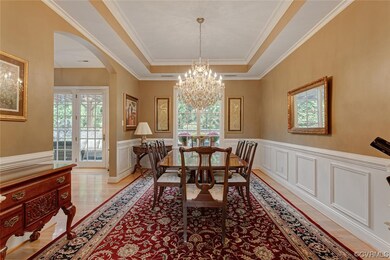 Dining room featuring an inviting chandelier, crow