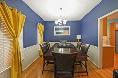 Dining area with a chandelier and light wood-type flooring