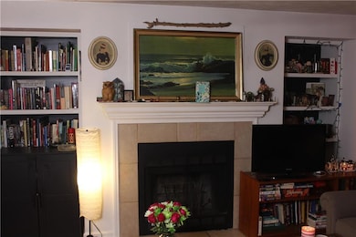 Living area with a tile fireplace