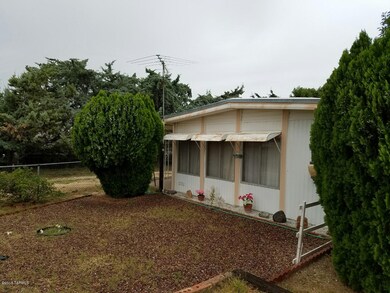 S side of home 950 W Gateway St