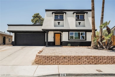 View of front of home with stucco siding, concrete