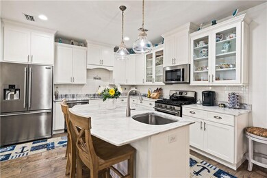 Kitchen and center island with bar seating