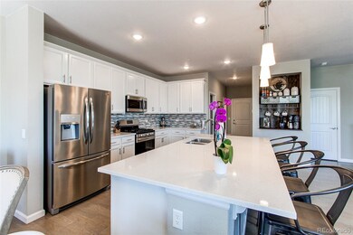 Stylish kitchen with upgraded quartz an stainless 