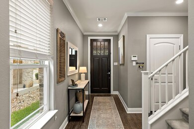 Foyer with baseboards, dark wood-type flooring, a