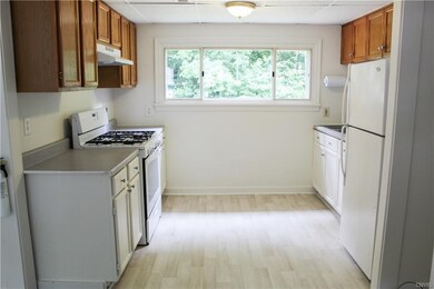 The kitchen has ample cabinetry and plenty of spac