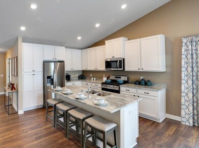 Stainless appliances, granite counter tops, maple cabinetry, all add to a beautiful and functional kitchen space. Model photo, colors and selections may vary.