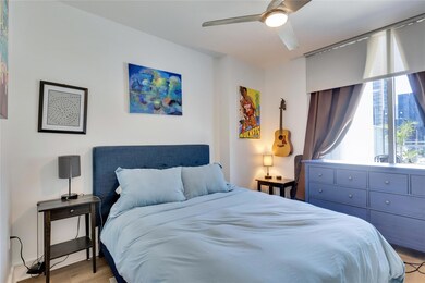 Bedroom featuring light wood-style flooring and c
