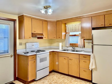 You walk into the kitchen from the back door