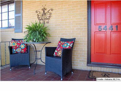 The nice front porch has beautiful tile flooring &