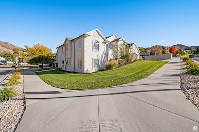 View of home's exterior with a mountain view, stucco siding, and a residential view