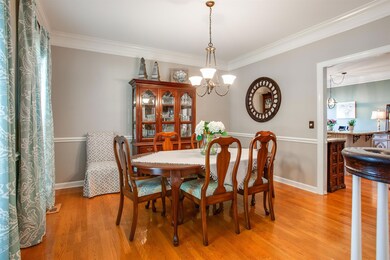 Plenty of space in this formal dining room with chairail and beautiful trim....