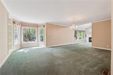 Unfurnished living room with an inviting chandelie