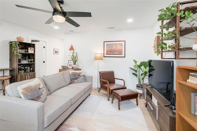 Living room featuring light wood-type flooring, c