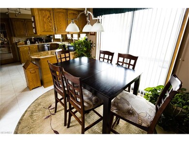 Kitchen with sliding door to enclosed patio area.