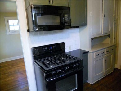Kitchen. The hardwood floors are continuous throug