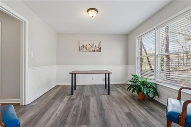 Office area featuring wood finished floors and a w