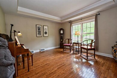 Living room off the entry way with tray ceiling, H