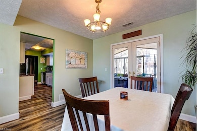 Dining room has entrance to the screened in 3 seas