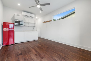 Kitchen with freestanding refrigerator, a wall un