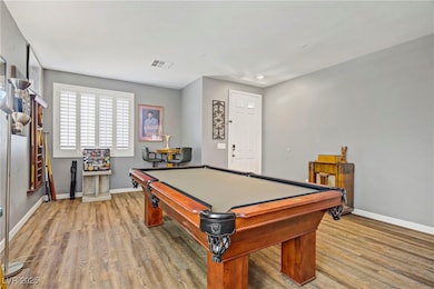 Recreation room featuring billiards table and wood finished floors