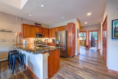 Kitchen featuring stainless steel appliances, wood