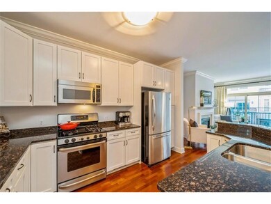 Large open kitchen with granite counter tops, stai